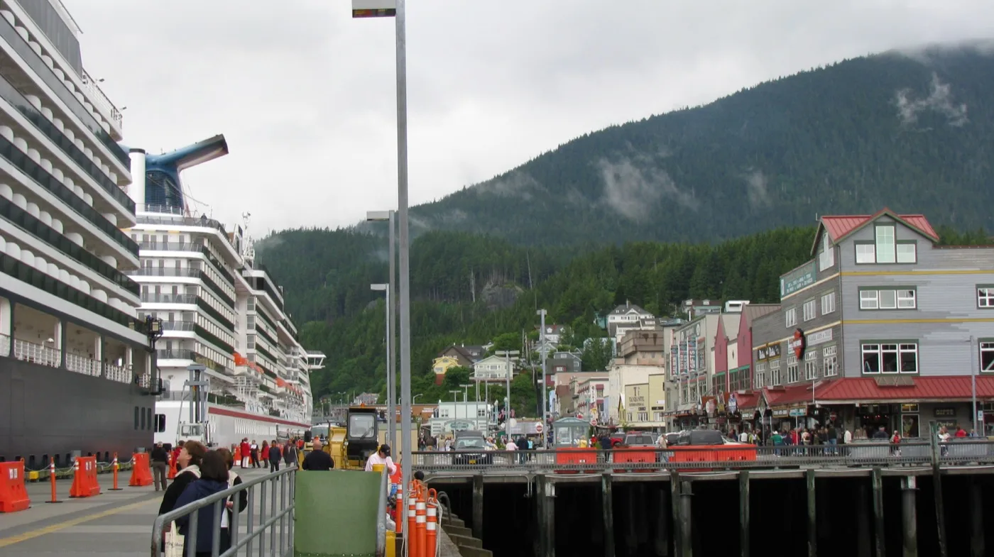A cruise ship berthed directly alongside Ketchikan's downtown waterfront buildings