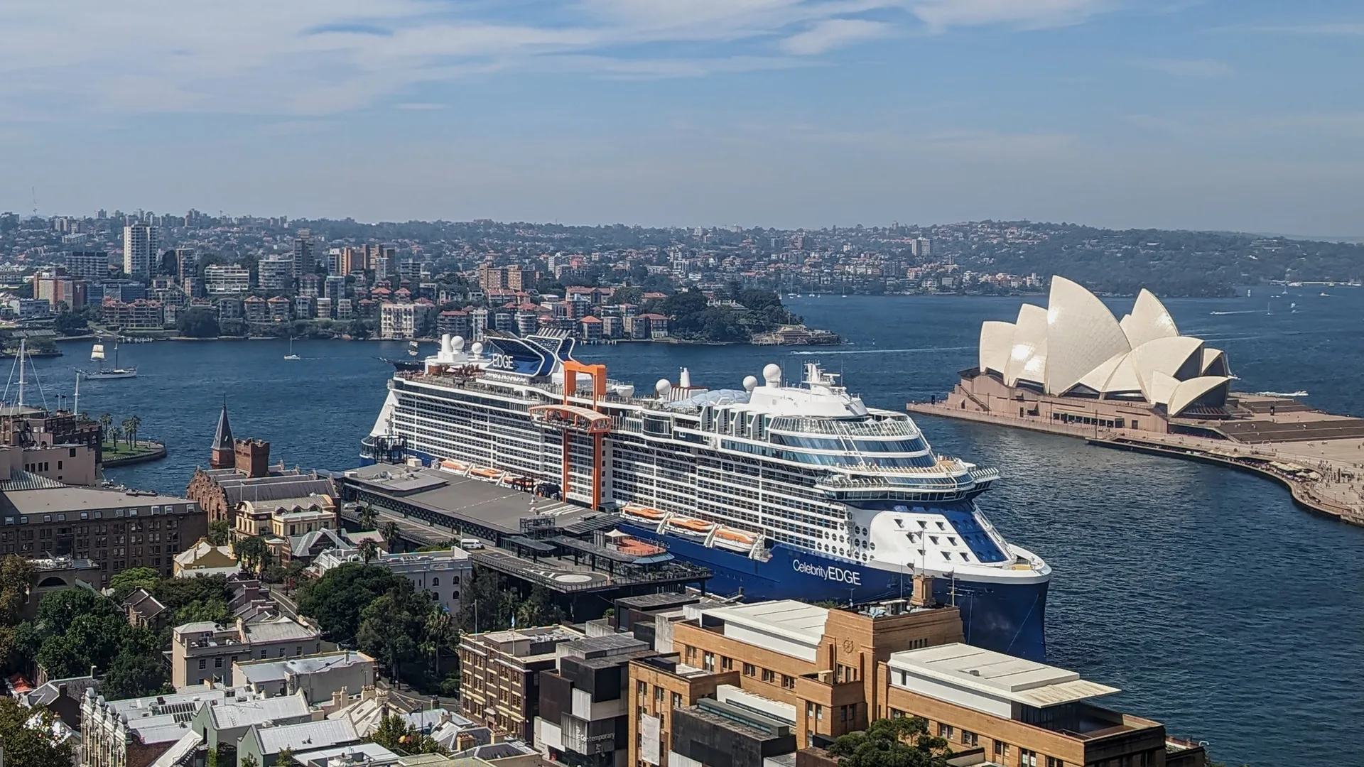 Celebrity Edge berthed at Circular Quay in Sydney, with the Opera House beyond