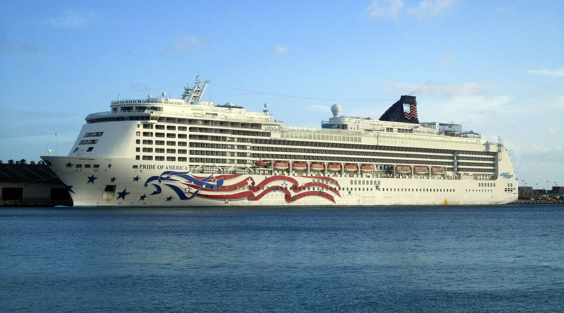 Norwegian Cruise Line's Pride of America alongside in Honolulu, the home port closed by Tropical Storm Lala in August 2026