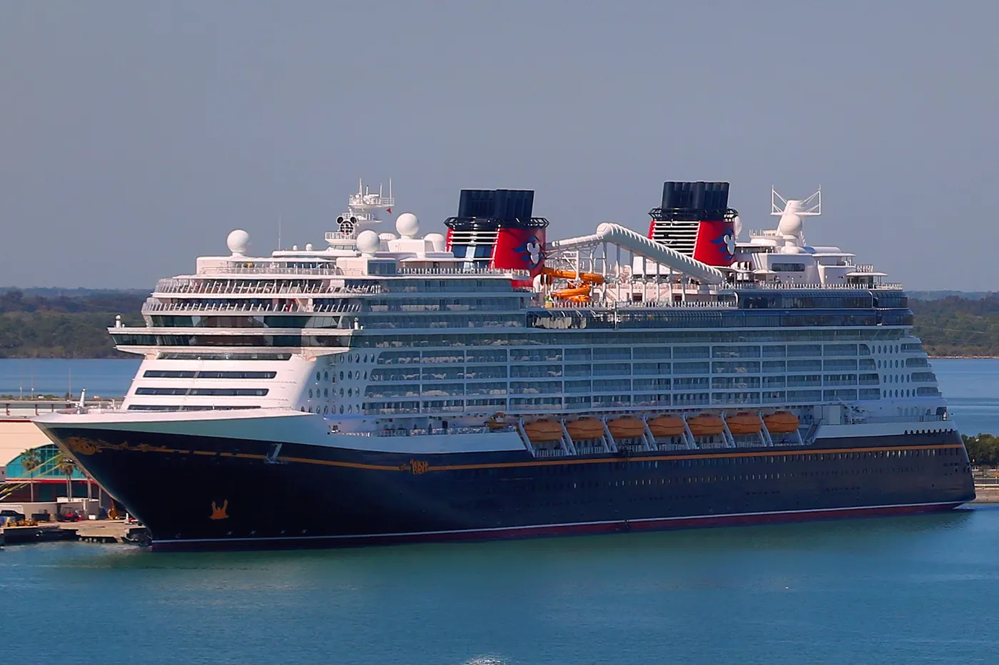 The Disney Wish berthed at Port Canaveral, seen from the quay with her bow and forward superstructure in view