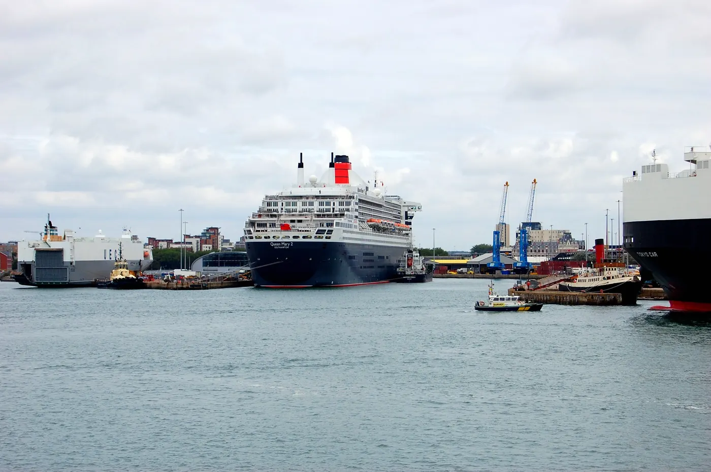 Cunard's Queen Mary 2 alongside at Southampton, her black hull and red funnel filling the frame