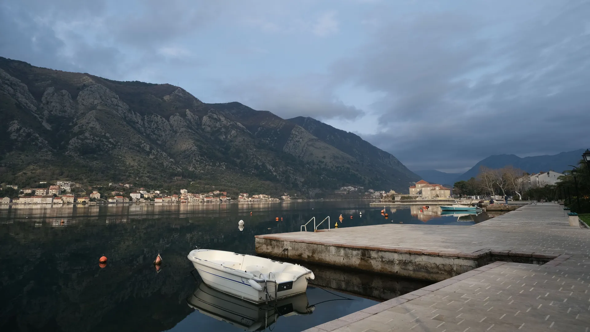 Kotor Bay on a calm morning with mountains rising behind the water