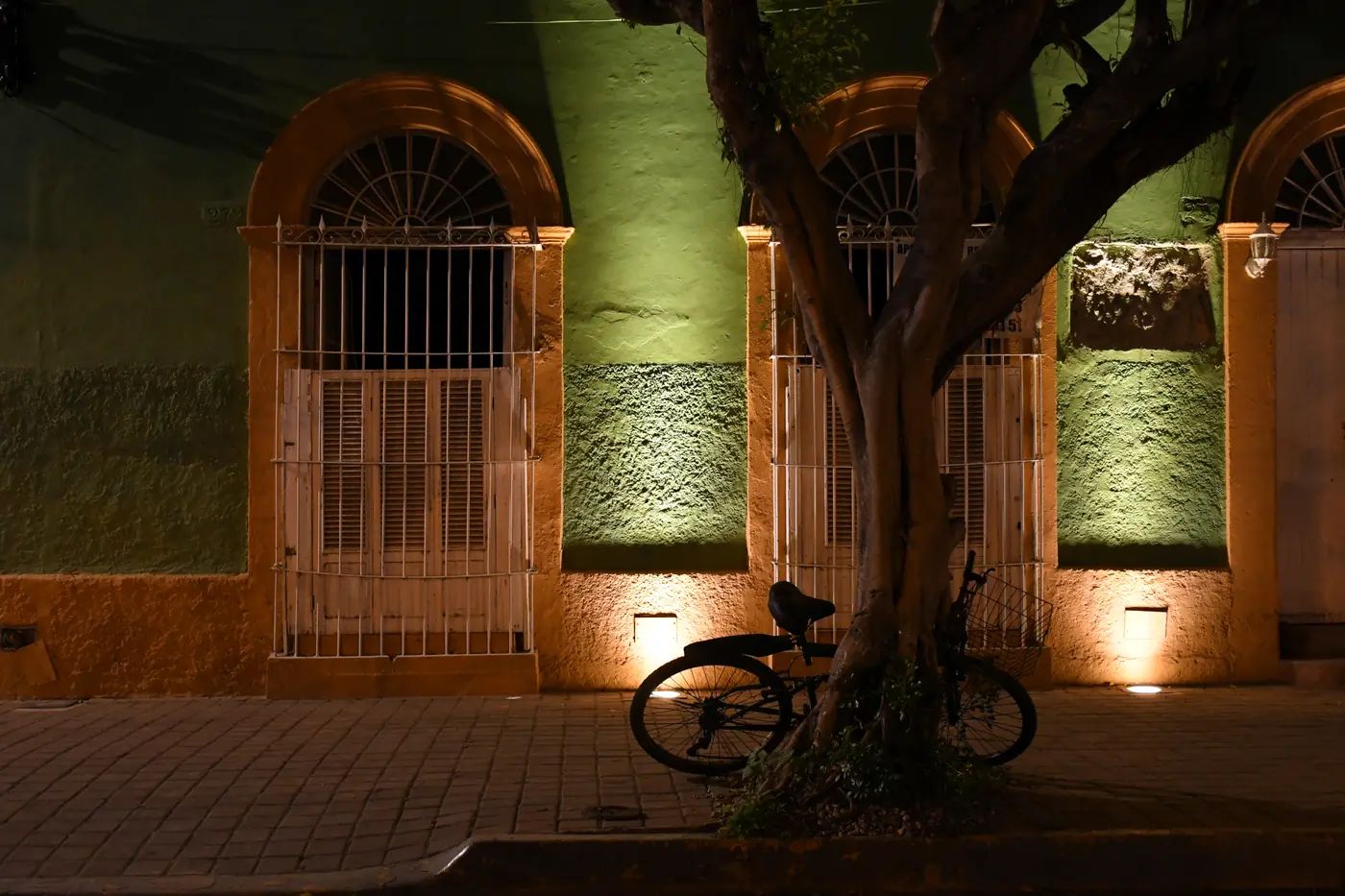 Plazuela Machado in Mazatlán's Centro Histórico, colonnaded buildings and café tables around a shaded plaza
