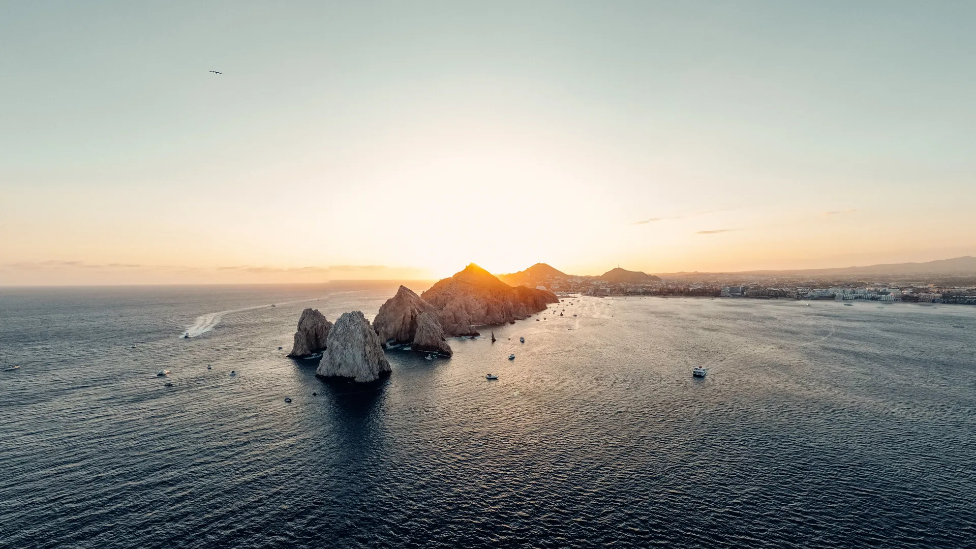 Rock formations and a bay along Mexico’s Pacific coast at sunset
