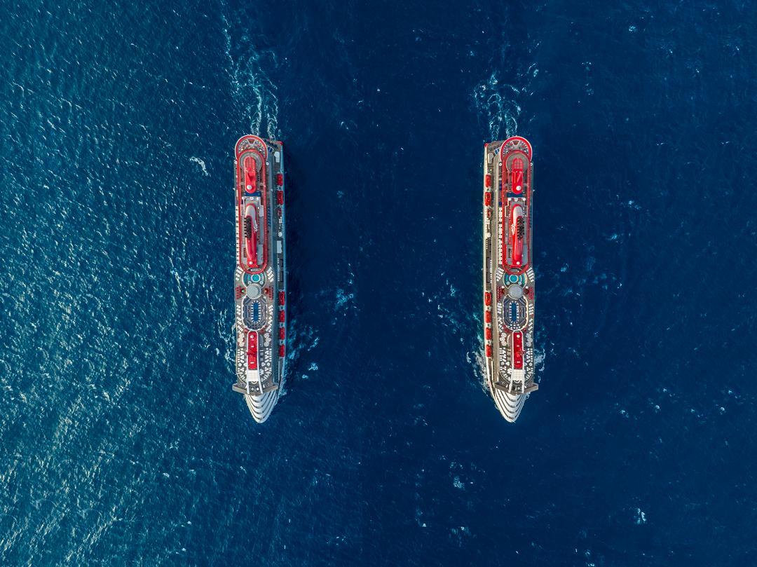 Scarlet Lady at sea — the best moment to run your Virgin Voyages MNVV Sailor Loot stack math before visiting Sailor Services