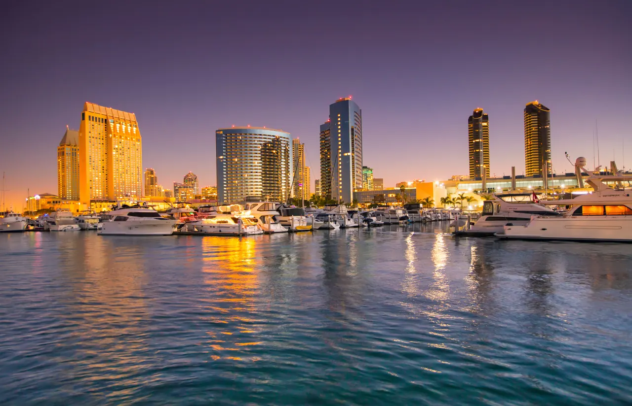 San Diego's downtown skyline seen across the harbor, with yachts moored in the foreground