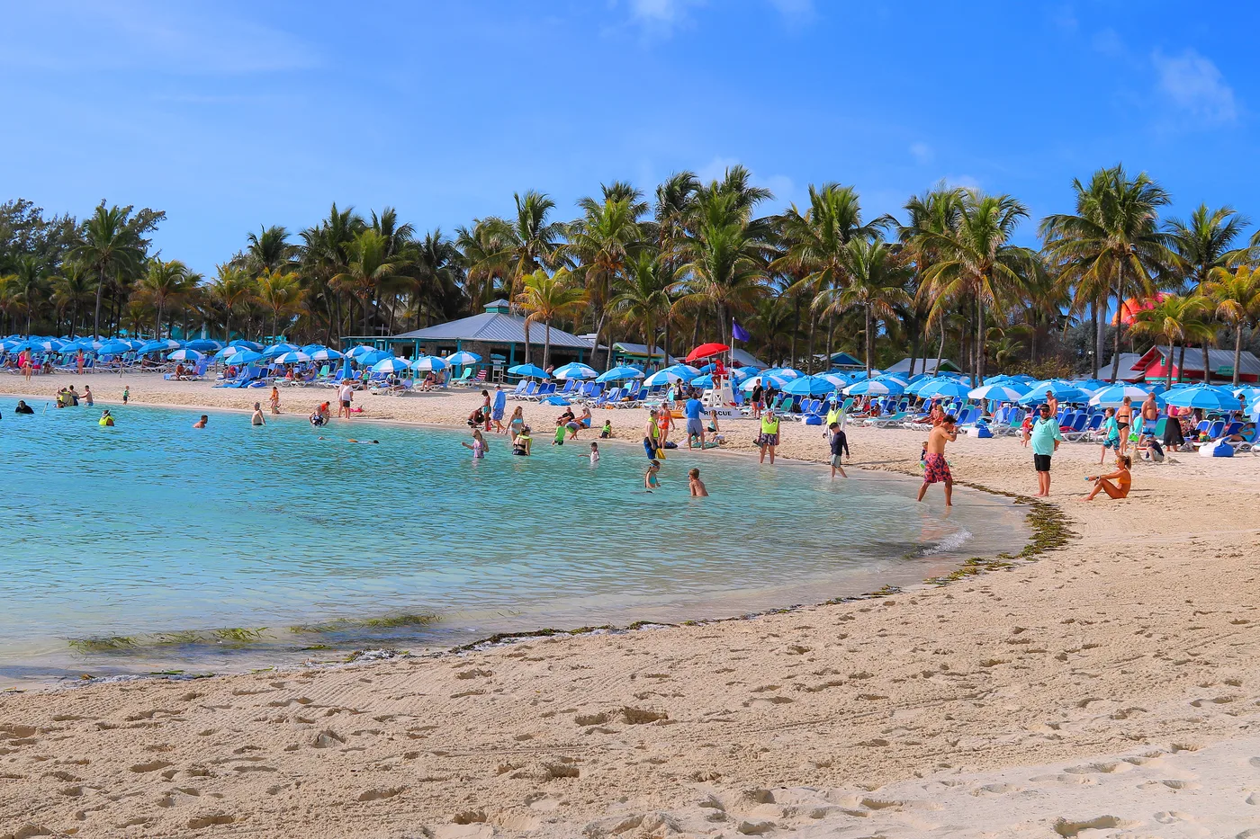 Chill Island beach at Perfect Day at CocoCay, with loungers set on deep soft sand