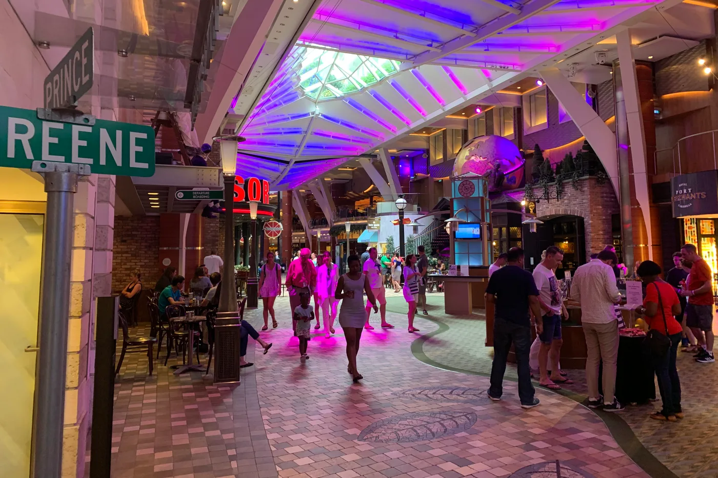 The Royal Promenade aboard Oasis of the Seas, a wide multi-deck interior thoroughfare