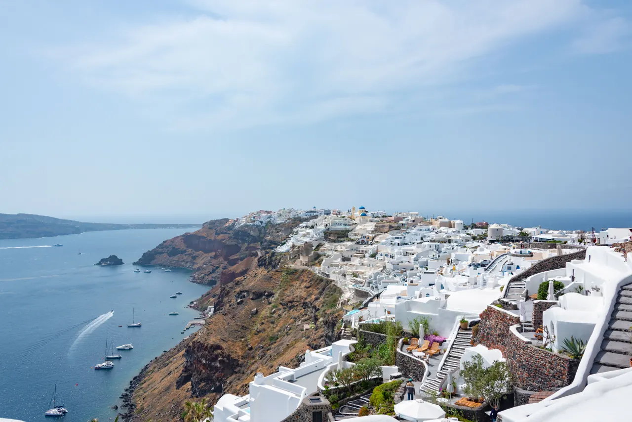Picturesque view of Santorini’s white architecture along the blue Aegean Sea.