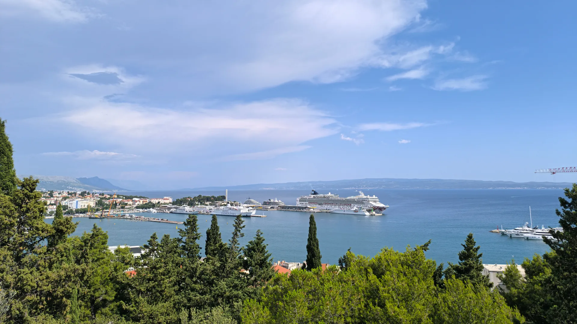 Panoramic view of Split harbor with cruise ships moored beyond the old town