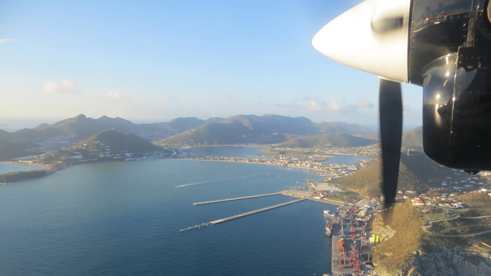 Great Bay and Philipsburg seen from the air, the curve of the bay backed by hills