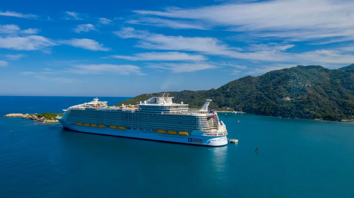 A packed cruise ship deck — record demand is pushing load factors past 110%
