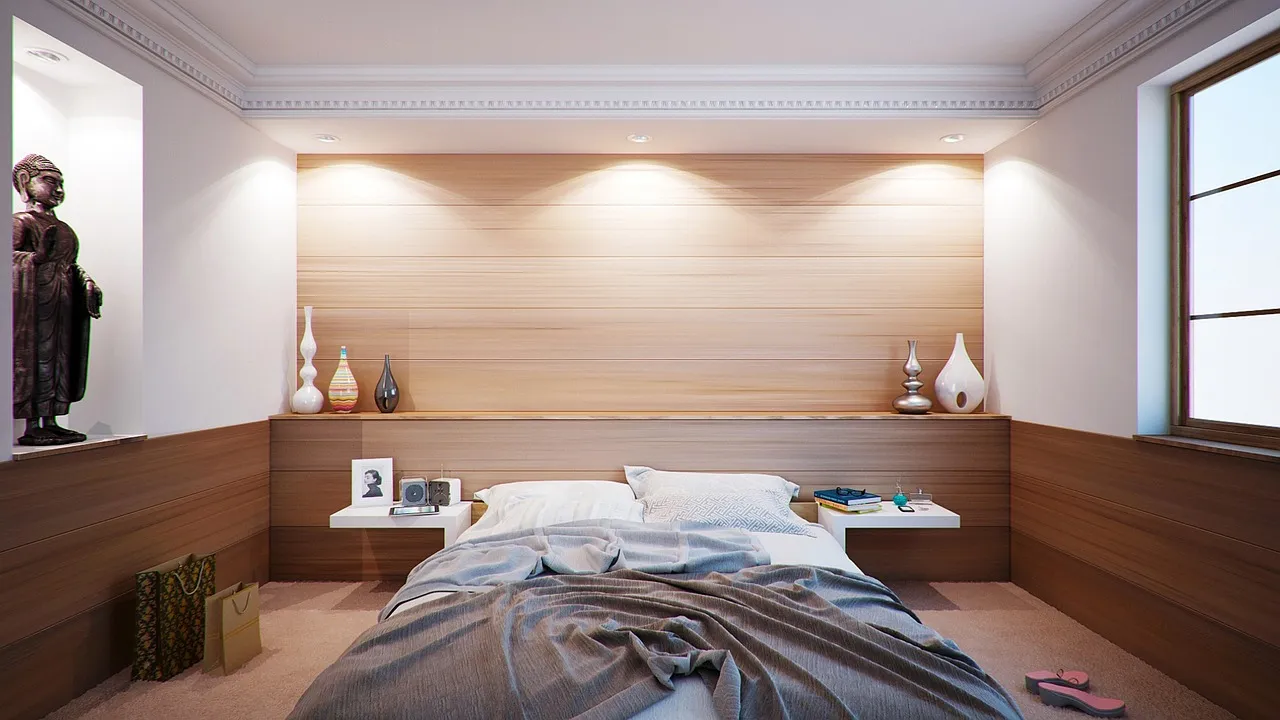 A modern luxury cruise cabin with ocean light through the balcony door