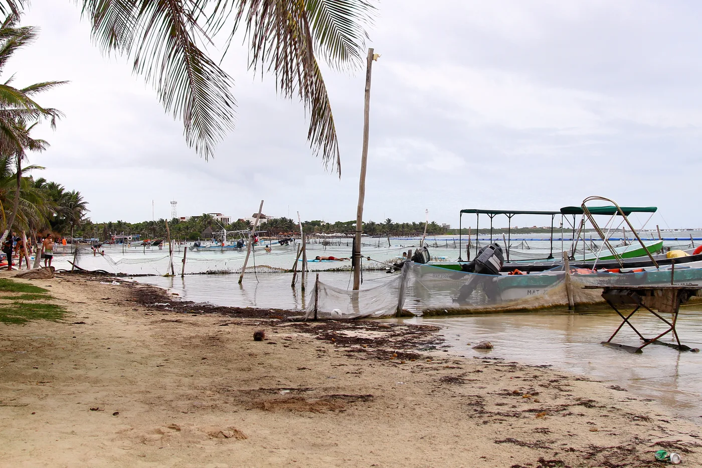 Fishing boats moored off the beach at Mahahual, Quintana Roo, Mexico