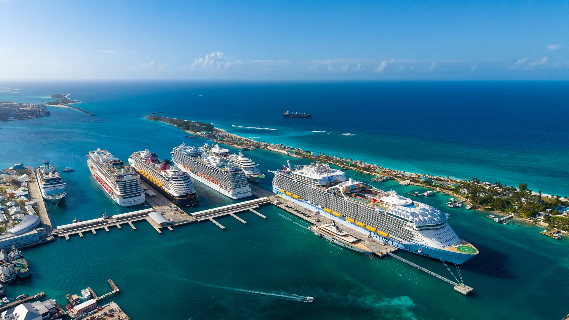 Six cruise ships berthed at Nassau Cruise Port in the Bahamas, seen from the air